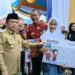 Al Haris Serahkan Bantuan Peralatan dan SPP Program Dumisake Pendidikan di Merangin