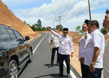 Jalan Batang Asai Mulus di Era Gubernur Al Haris, Warga Gelar Syukuran